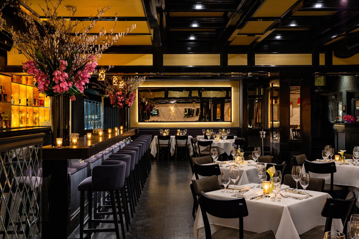 a dining room with tables and chairs